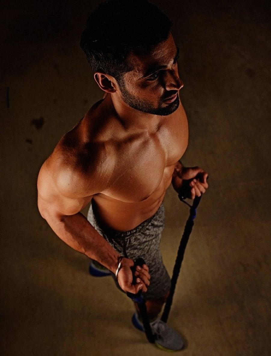 Coach guiding a shoulder mobility position
